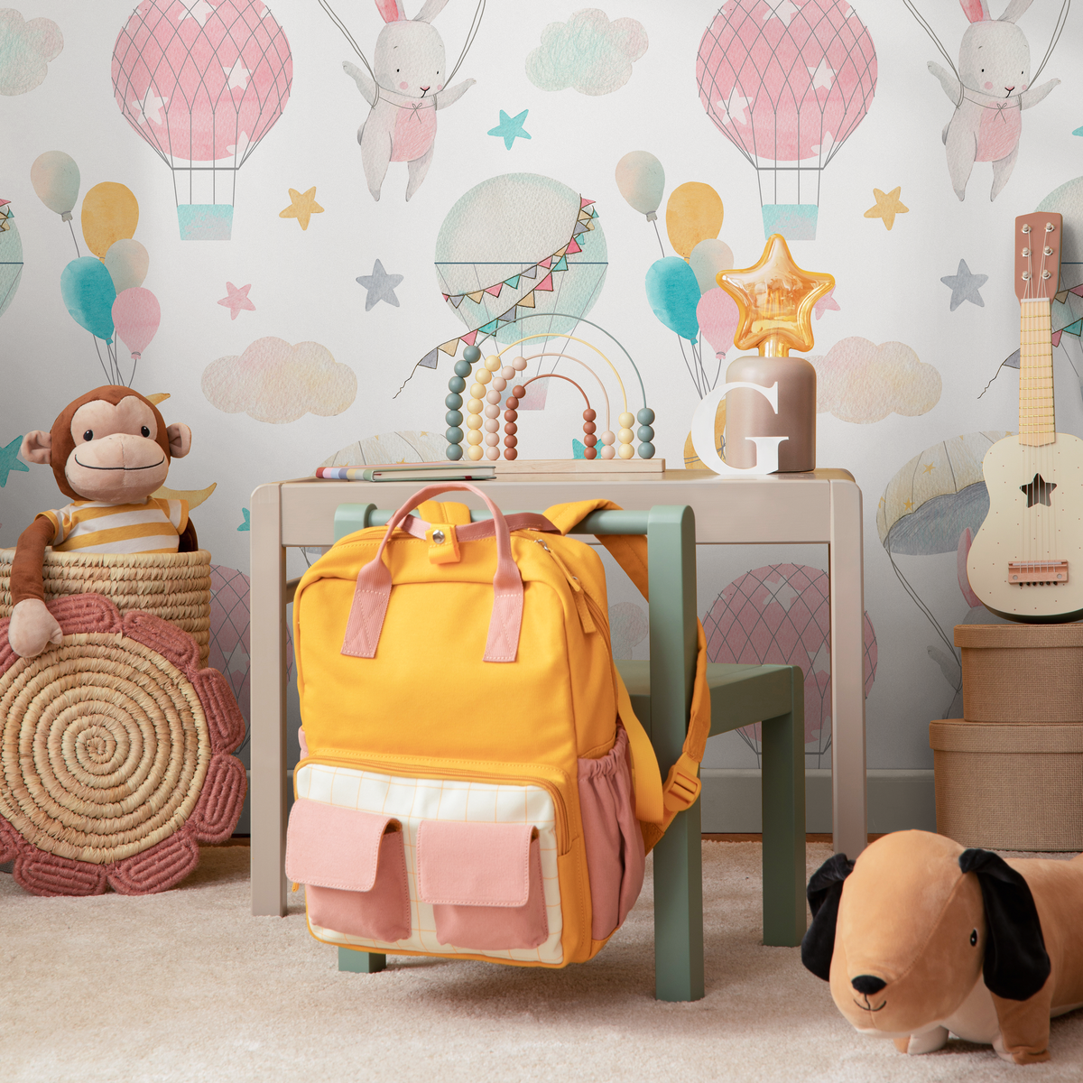 Nursery Wallpaper with Watercolor Bunnies and Balloons in Pink, Blue, and Yellow - detail view